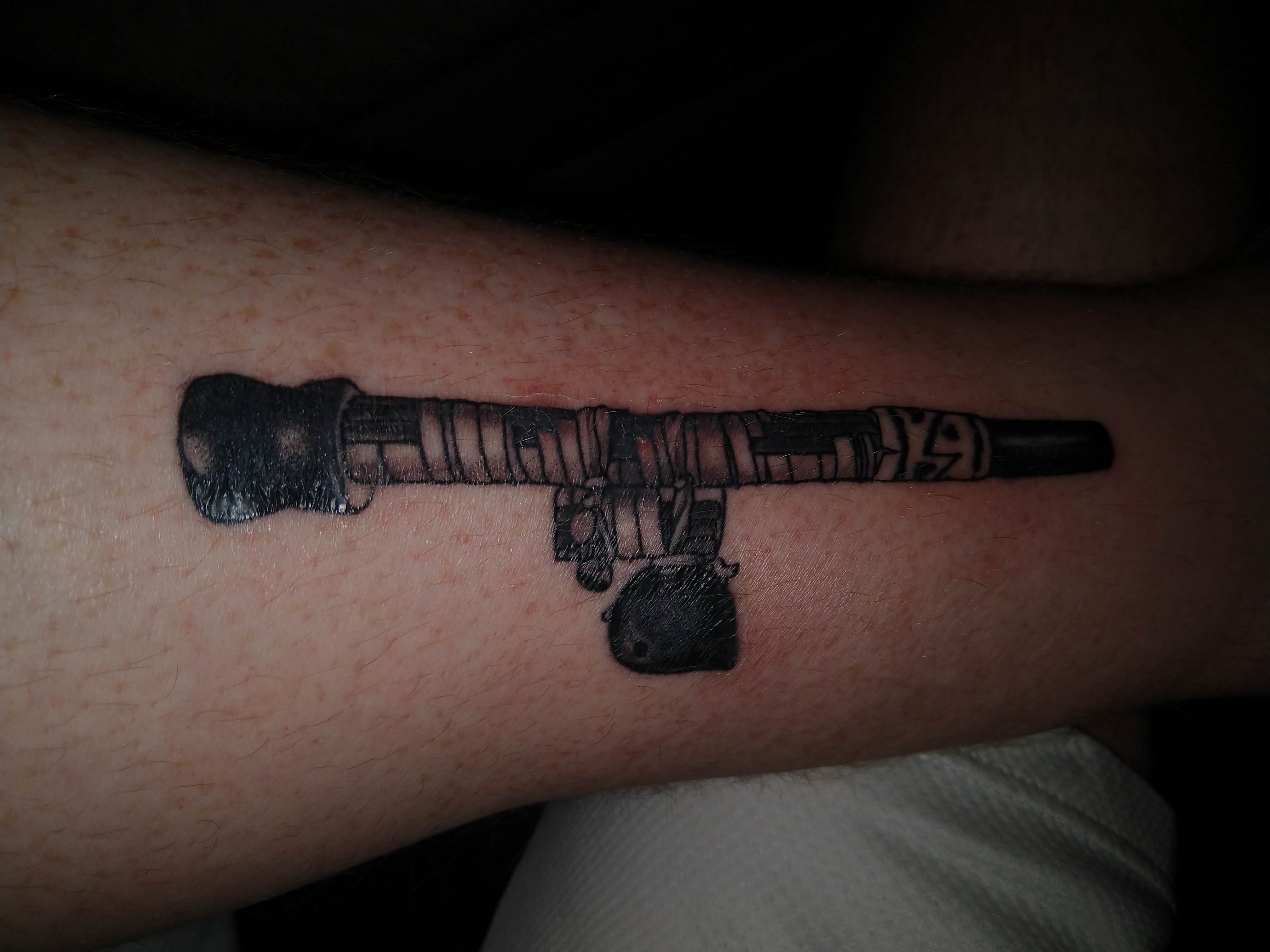 A blowgun tattoo on the inside of my left leg